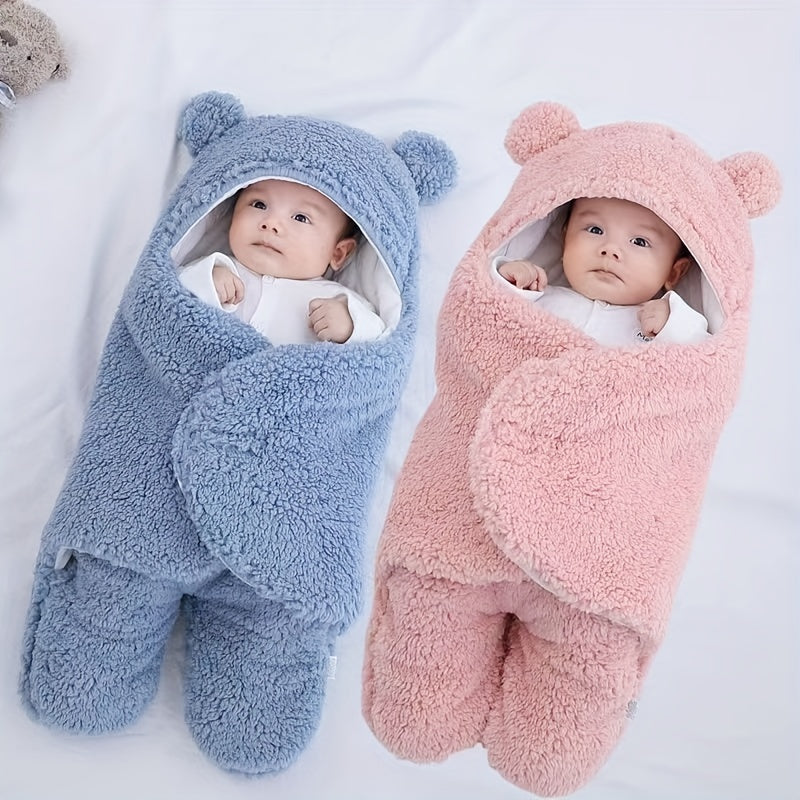 Two babies wrapped in soft bear-ear baby sleeping bags in blue and pink